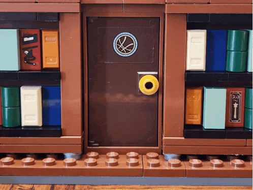a lego door with a yellow knob is surrounded by bookshelves