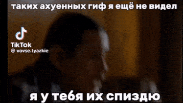 a man in a black shirt is talking in a foreign language ..
