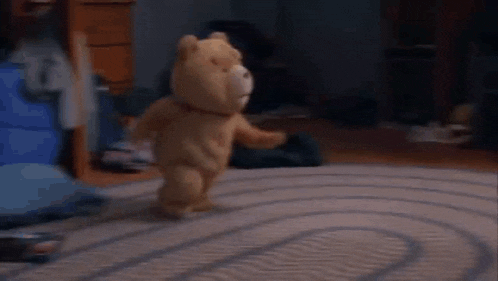 a teddy bear is running on a rug in a living room .