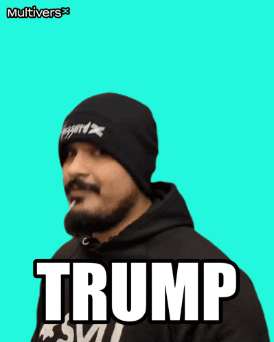 a man wearing a beanie and a hoodie with the word trump on it