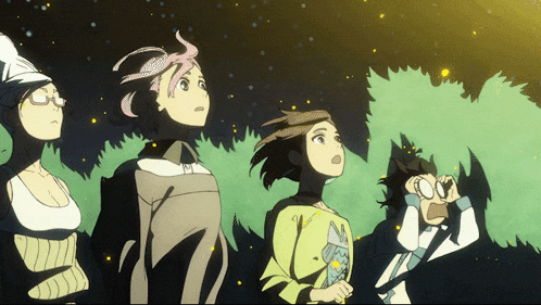 a group of people are looking up at the stars