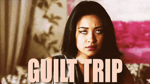 a woman is making a funny face in front of a sign that says guilt trip .