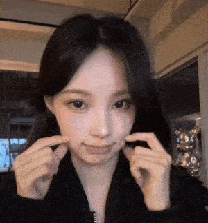 a woman making a funny face with her hands