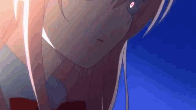 a close up of a girl with pink hair and red eyes against a blue sky .