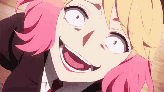 a girl with pink hair and yellow hair making a funny face