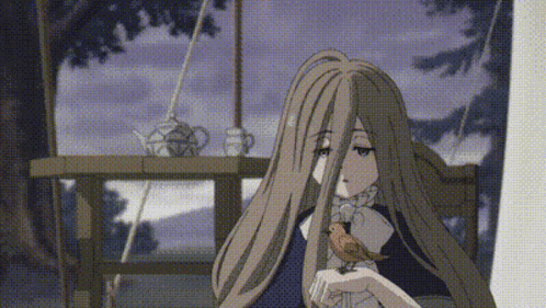 a woman with long hair is holding a small bird