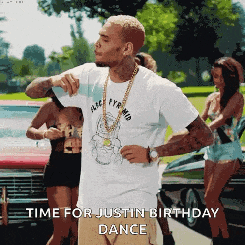 a man in a white t-shirt is dancing in front of a group of women and says time for justin birthday dance .