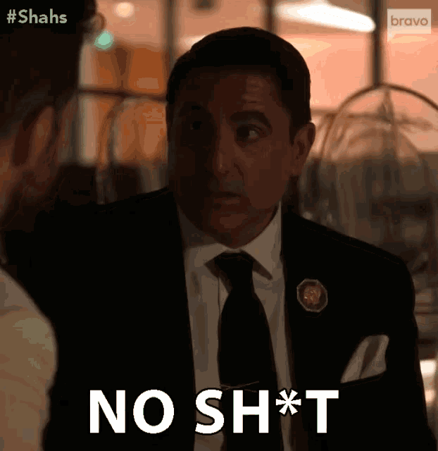 a man in a suit and tie is saying no sh*t