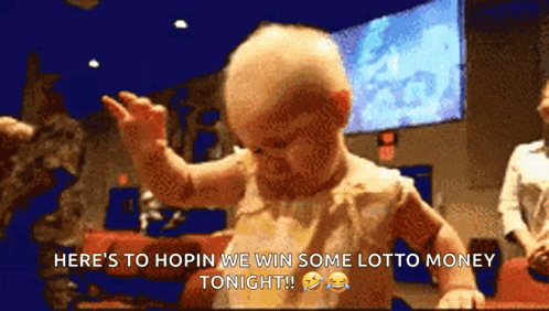 a baby says here 's to hopin we win some lotto money tonight