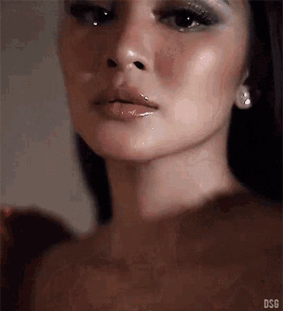 a close up of a woman 's face with a watermark that says dsf