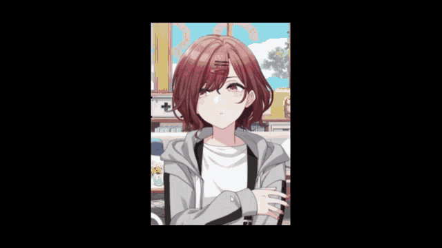 a girl with red hair is wearing a hoodie and a white t-shirt that says ' a ' on it