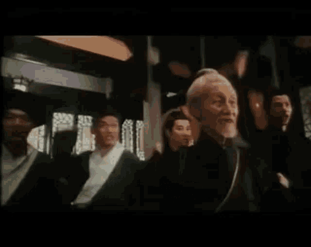 a man in a black suit says burn his house beat his mother in chinese