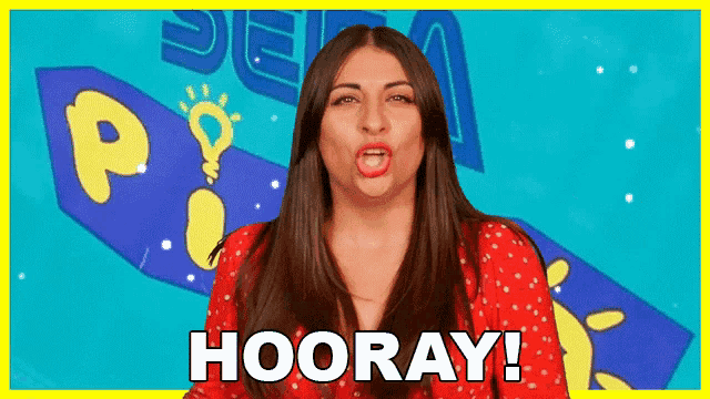 a woman in a red dress is making a funny face and saying hooray .