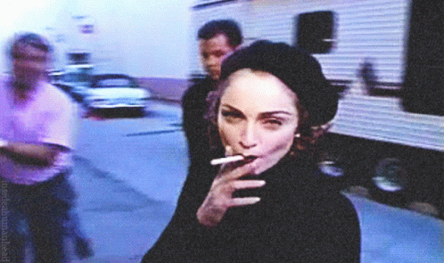 Madonna Smokes GIF - Madonna Smokes Madonna Smokes Looking Looking Straight To Camera GIFs