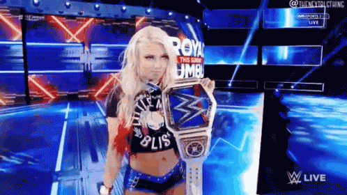 a woman is holding a wrestling championship belt that says royal umble
