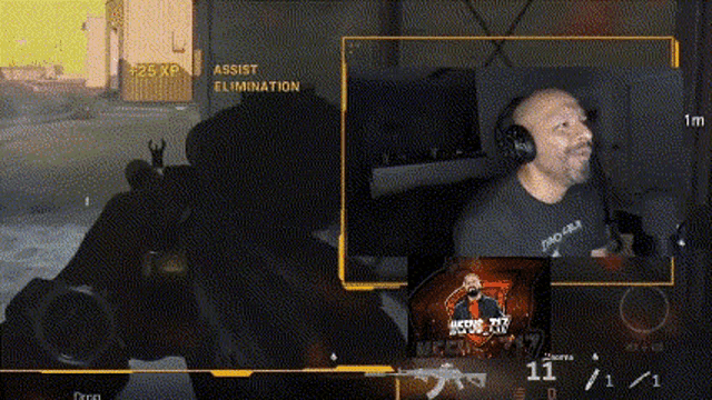 a man wearing headphones is playing a video game on a computer screen .