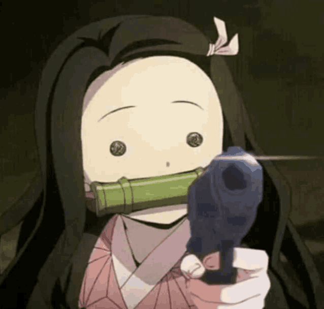 a girl is holding a gun in her hand and pointing it at the camera .