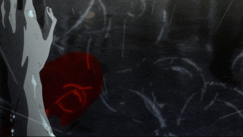 a hand is reaching out towards a bloody object