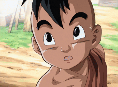 a close up of a child 's face with a surprised look on his face