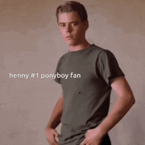 a young man stands with his hands in his pockets with the caption henny # 1 ponyboy fan behind him