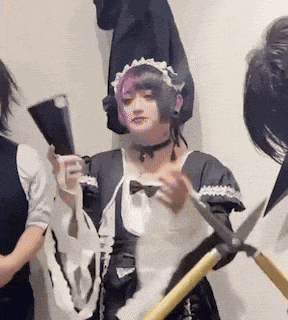 a woman in a maid costume is holding scissors