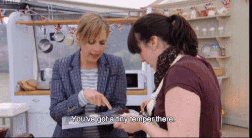 two women are talking in a kitchen and one of them says you 've got a tiny temper there