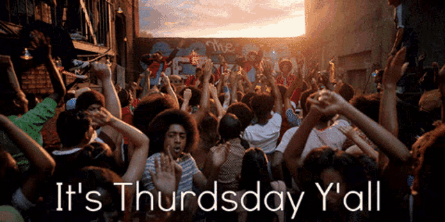 a crowd of people dancing with the words it 's thursday y 'all below them