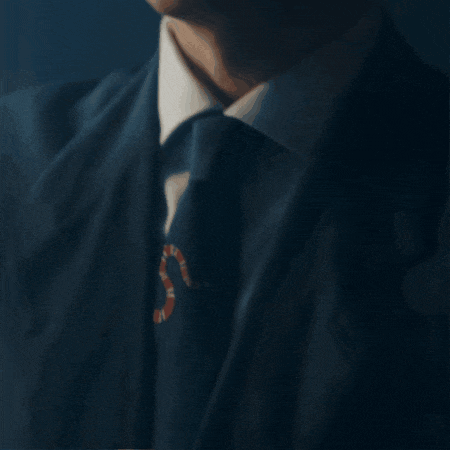 a close up of a man 's face against a dark blue background