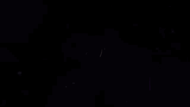 a blurred image of a person 's face with a blue background