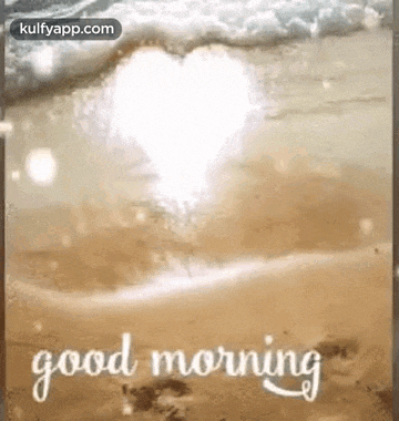 a good morning greeting card with a heart in the water on the beach .