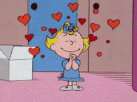 a cartoon of a girl with hearts coming out of her eyes