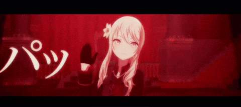 a girl with long hair and red eyes is standing next to another girl in a red room .