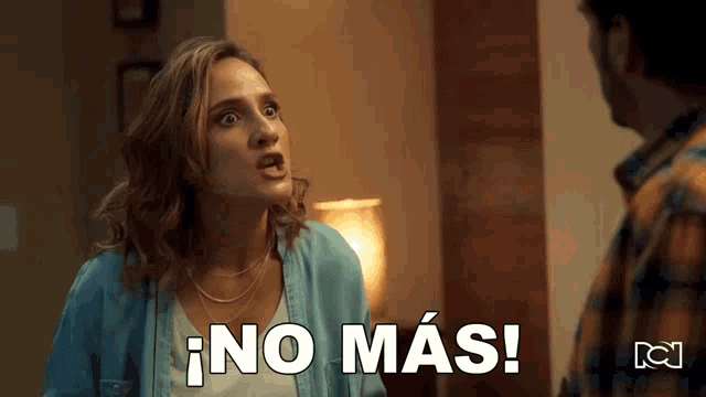 a woman in a blue shirt is talking to a man in a plaid shirt and says " no mas "