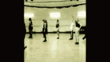 a black and white photo of a group of people rollerblading