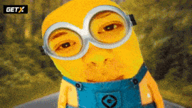 a yellow minion wearing overalls and goggles with a getx logo behind him