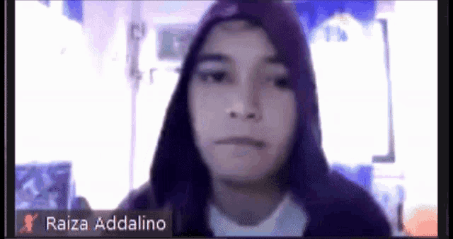 a person with a purple hoodie and the name raiza addalino on the bottom