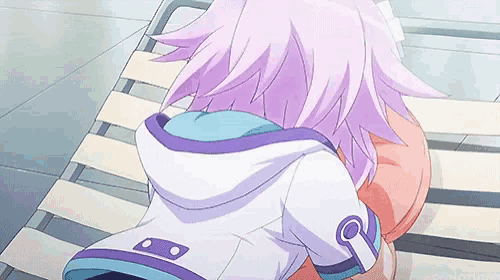 a girl with purple hair is sitting in a chair