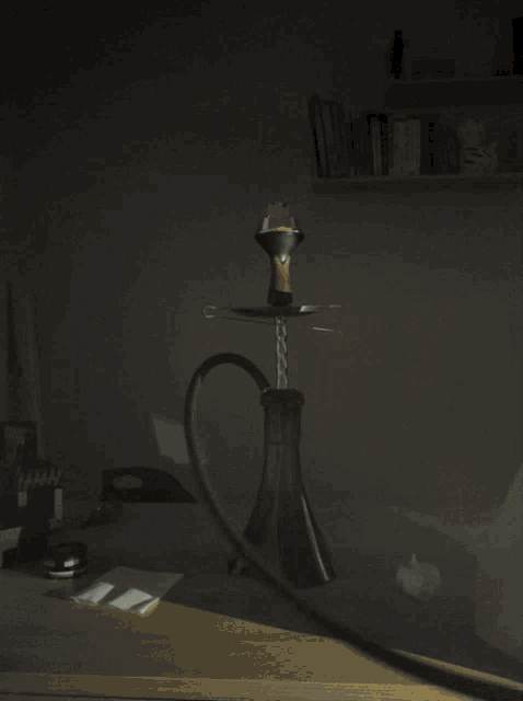 a hookah with smoke coming out of it on a table