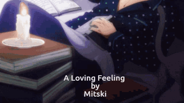 a loving feeling by mitski is displayed on a screen