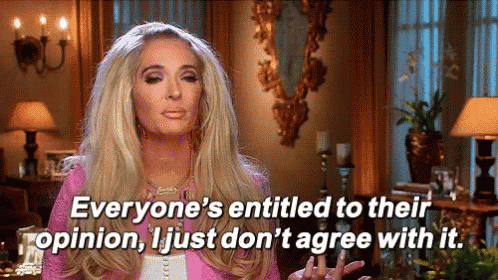 a woman in a pink jacket is saying everyone 's entitled to their opinion , i just do n't agree with it
