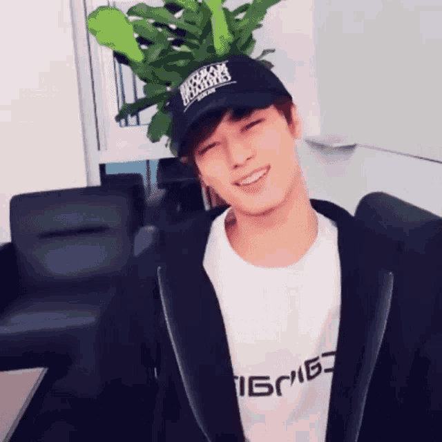 a young man wearing a black hat that says brooklyn islanders on it