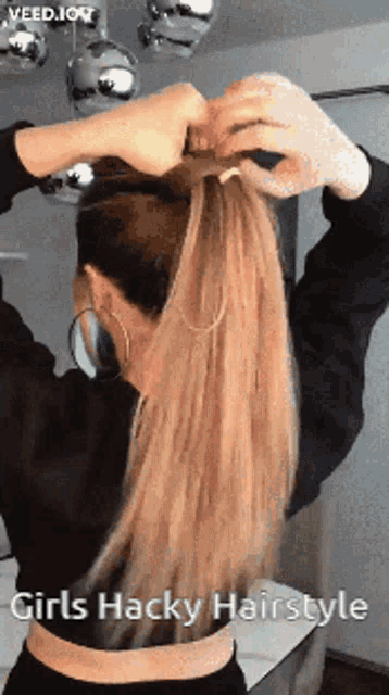 a woman is putting her hair in a ponytail with the words girls hacky hairstyle below her