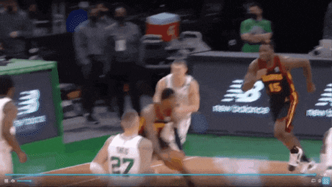 a basketball player wearing a green jersey with the number 27