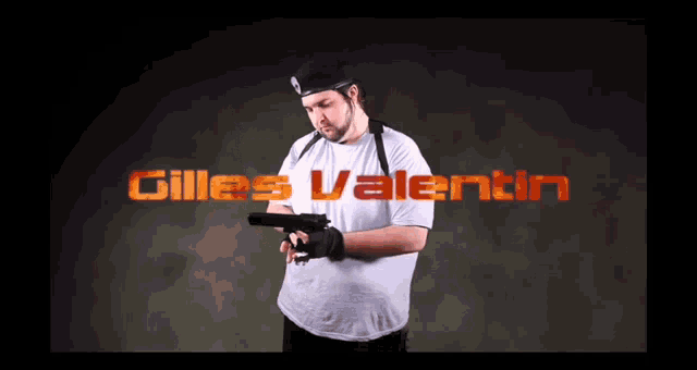 a man holding a gun with gilles valentin written on the screen