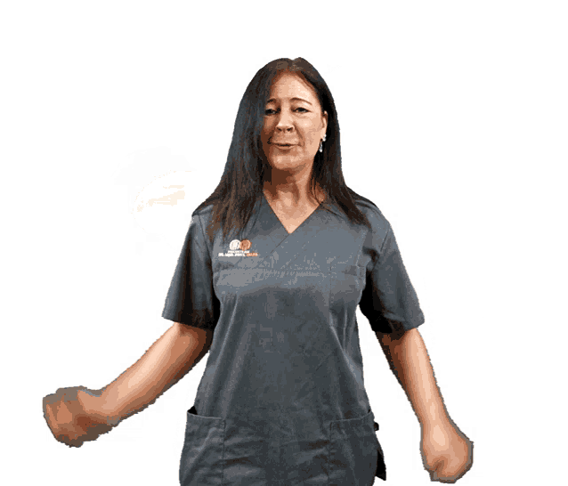 a woman wearing a scrub top that says ' surgical ' on it
