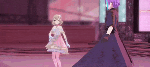 a girl in a pink dress and a girl in a purple dress are standing next to each other on a stage .