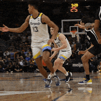 a basketball player with the number 13 on his jersey is dribbling the ball