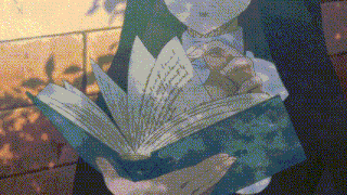 a person is holding a book in their hands and reading it .