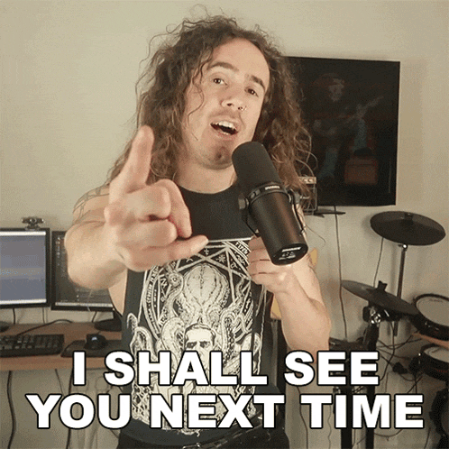 a man with long curly hair is pointing at the camera and says i shall see you next time