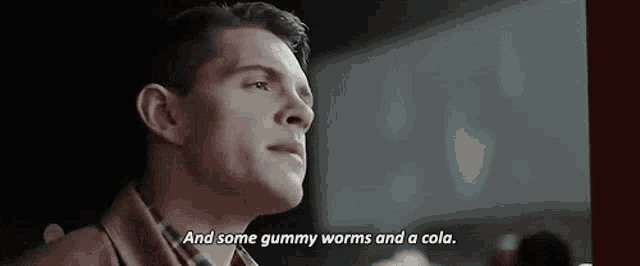 a man is talking about gummy worms and a cola in a movie .